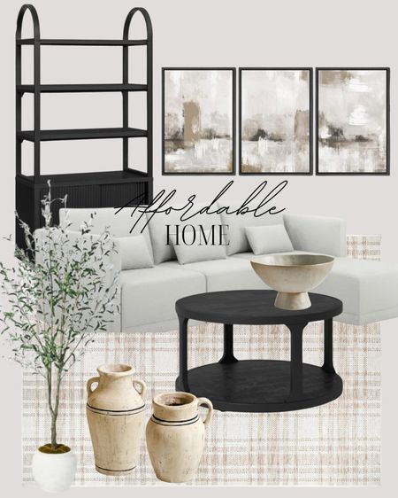 Get this living room look! I have the vases and olive tree and I love them both!! The art is so good and the sofa and everything shown here is too!

#LTKFindsUnder100 #LTKHome #LTKStyleTip