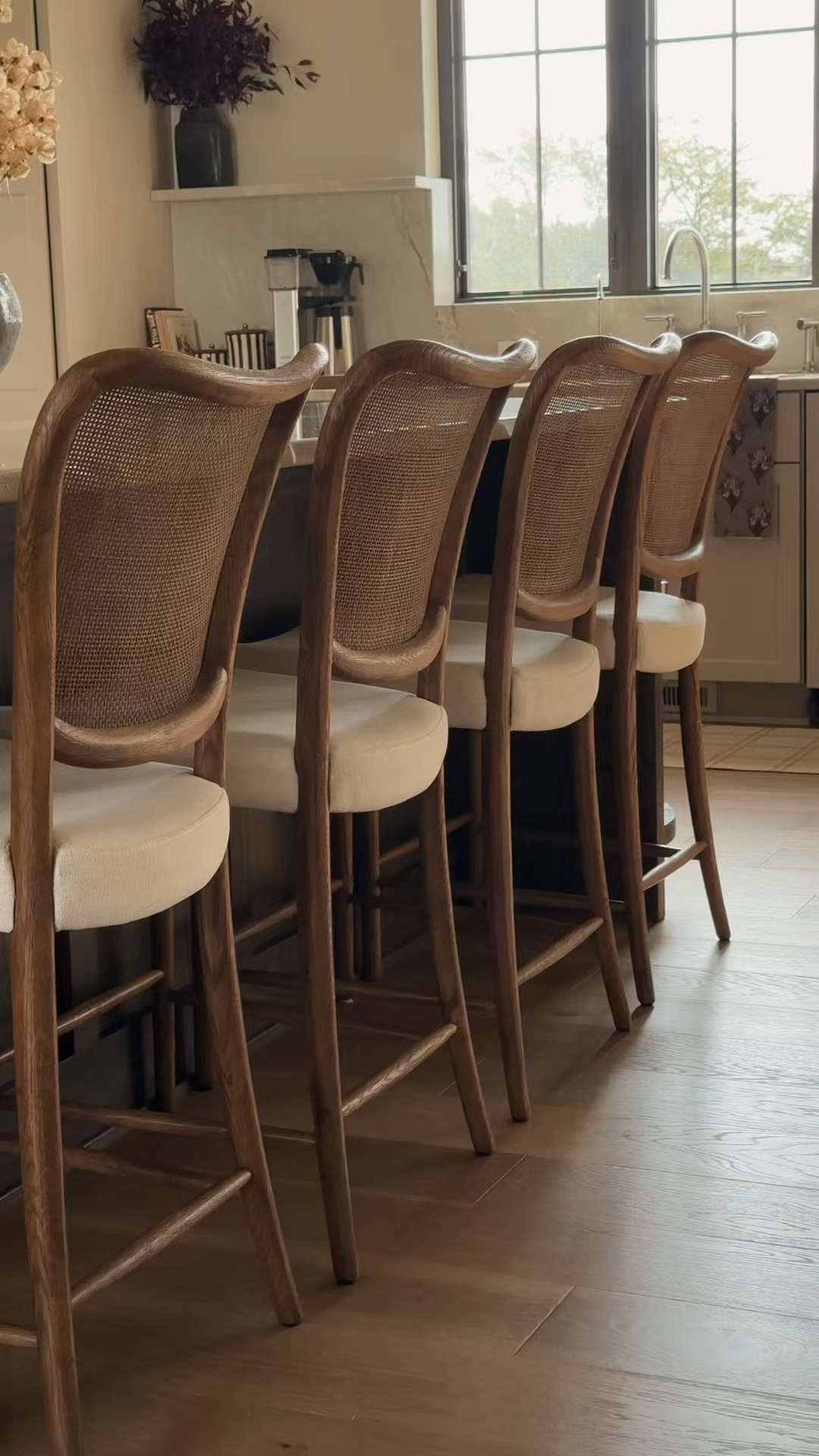 I love how the woven cane backs add warmth and texture to our kitchen 🤎 These stools from @Arhaus They are so comfortable and easy to move around. I linked a few similar alternatives #ltkhome
