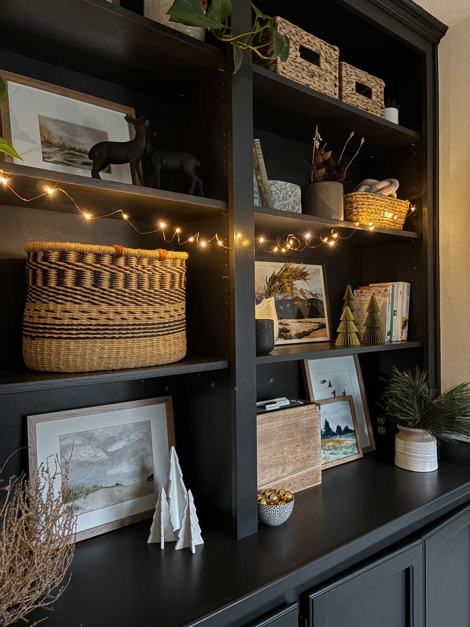 Christmas bookshelves made easy! 

Natural greenery plus evergreen art prints paper trees, and twinkly lights for super sweet shelf styling for the holidays

#LTKHoliday #LTKHome #LTKSeasonal