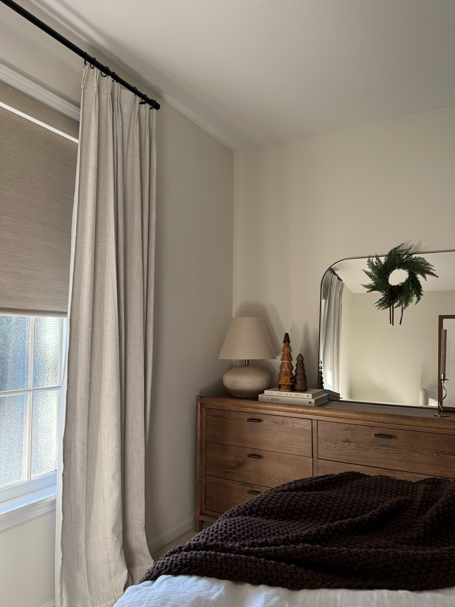 Cozy bedroom. Curtains are shade ‘nautral' in blackout and motorized shades are jacquard coffee also in blackout. I customized for a cleaner look with both a fabric-wrapped cassette and bar. Each shade comes with a remote that can be programmed with a ton of different options! No complaints so far, they’ve been amazing! This company sells on Amazon, but you can also order directly from the company website  

#LTKHome