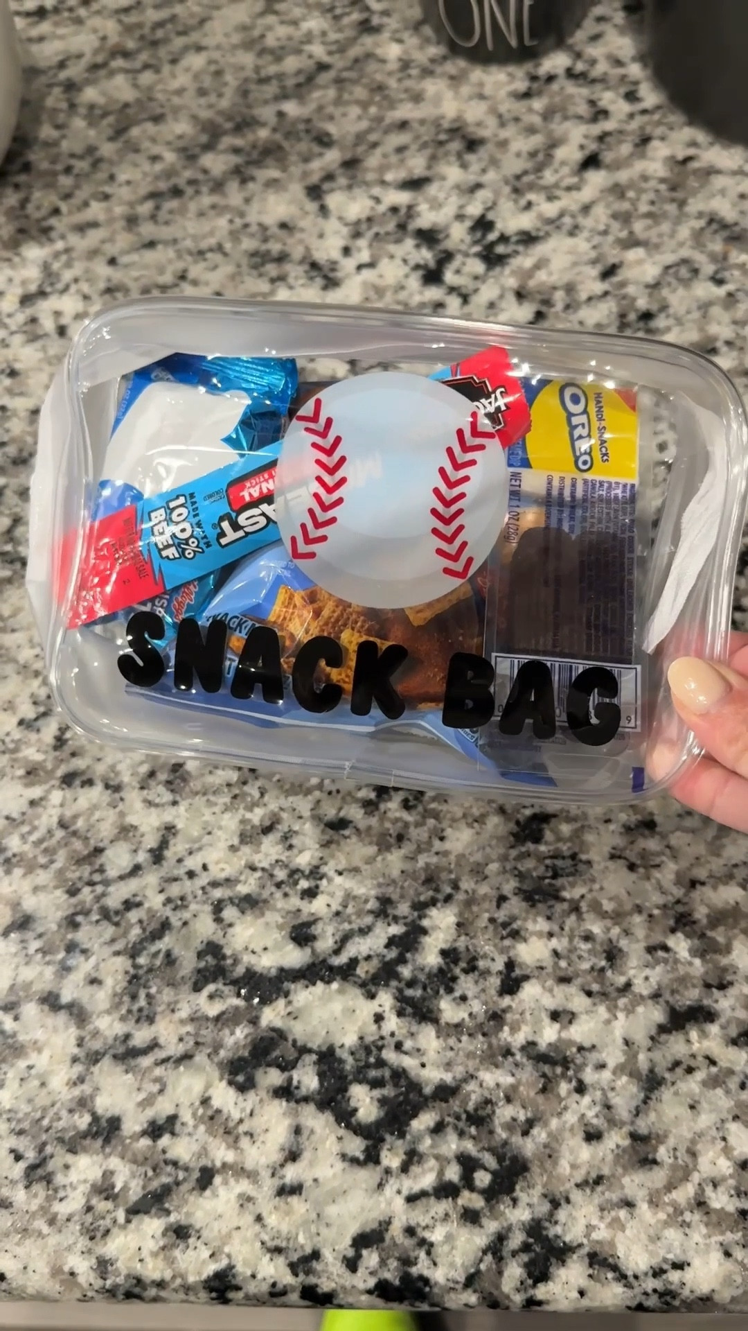 Game day snack bag ⚾️

Such a fun and easy idea if you’re bringing snacks for the team! These little snack bags are perfect for baseball practices and games. Just fill them with a few treats like mini cookies, crackers, and fruit snacks for a quick grab-and-go treat the kids will love.

Simple, cute, and makes snack duty so much easier for busy sports parents. Sharing the snack containers and goodies I used here!

#LTKFamily #LTKKids #LTKHome #BaseballMom #TeamSnack #GameDayTreats #SportsMomLife #BusyMomHack #SnackTime #LTKFinds

#LTKmomlife #LTKfoodie #LTKActive