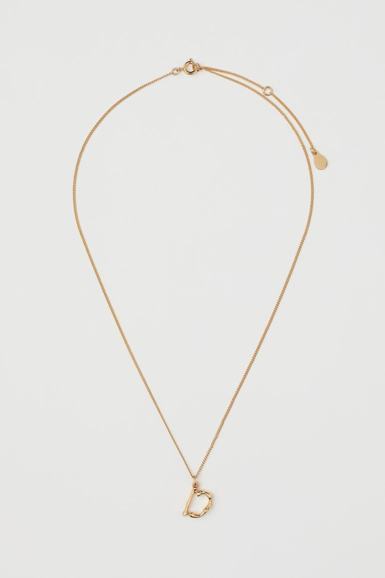 Necklace in gold-plated metal with a letter pendant. Adjustable length with a spring ring clasp a... | H&M (US + CA)
