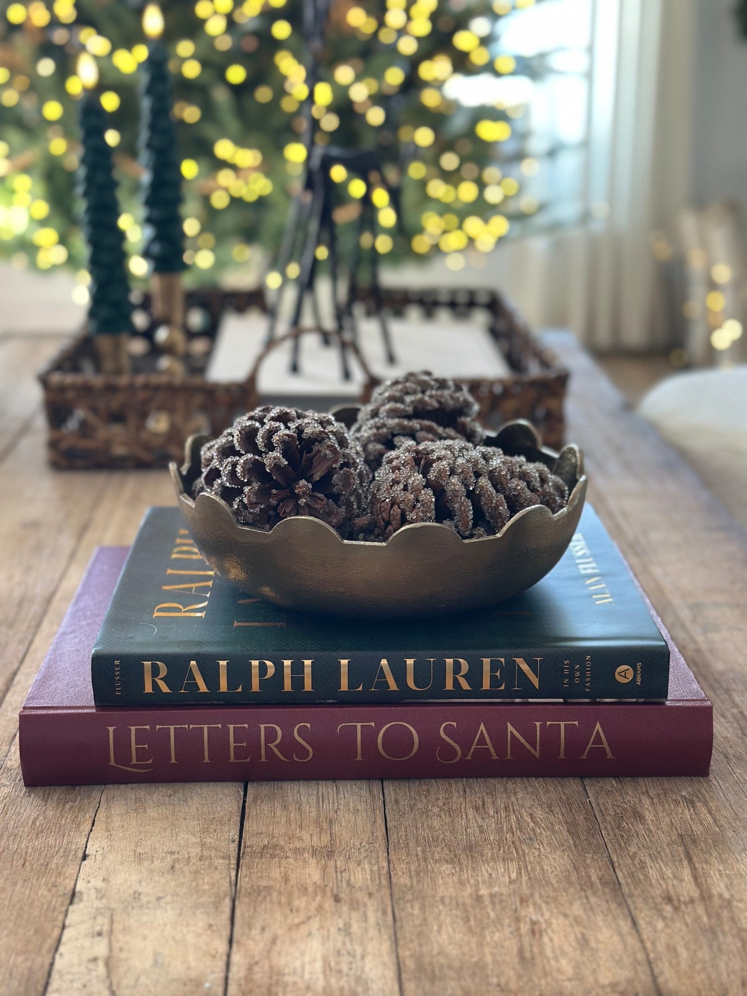 Christmas Books
Brass bowl
Pinecones 

#LTKSeasonal #LTKHome #LTKHoliday