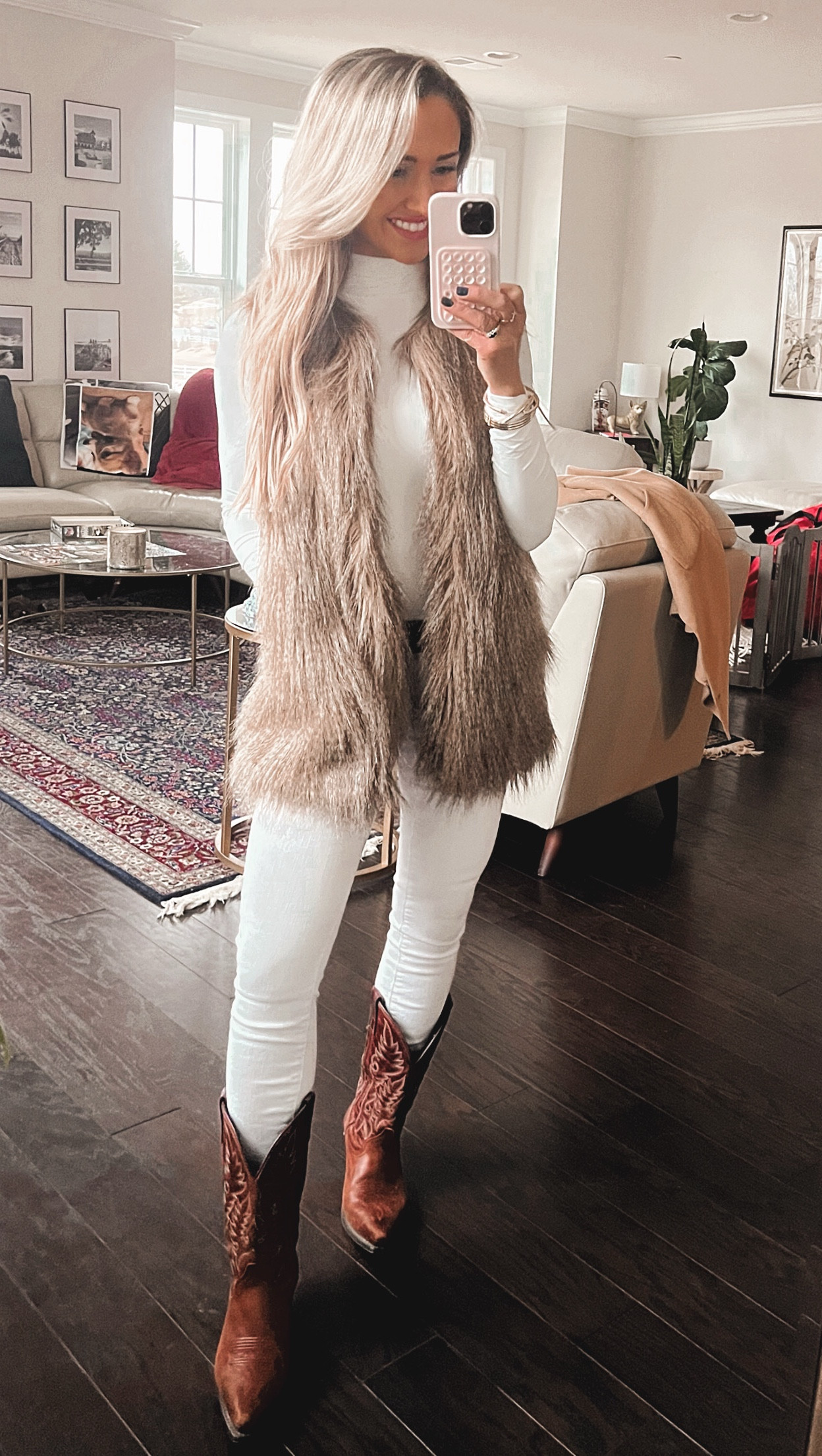 All white old money work look 

Work Outfits
Cowboy Boots
Oversized Fur Vest
White turtleneck bodysuit
White jeans
Large gold earrings