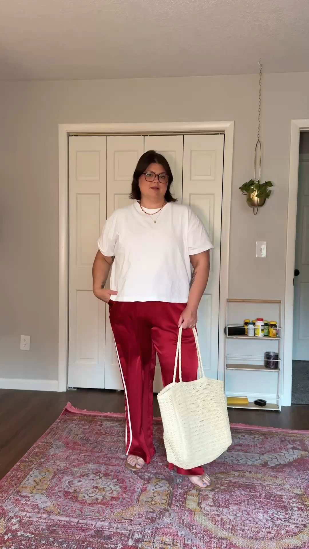 Denim shorts and an apron belly don't always get along, the waistband digs in and they never sit right, so here's what I wear instead: satin track pants, a white tee, and flip-flops. Size 16 here, and these pants are easily the most comfortable thing in my closet right now, no waistband fighting, just an easy drawstring and movement that doesn't pinch anywhere. Comfortable, still cute, zero shorts required. Linked everything on my LTK.

#LTKcurves #LTKstyletip #LTKfindsunder50 #apronbelly #apronbellyoutfit #size16style #midsizestyle #bodypositivefashion #comfyoutfit #ootd #satinpants #denimshortsalternative
