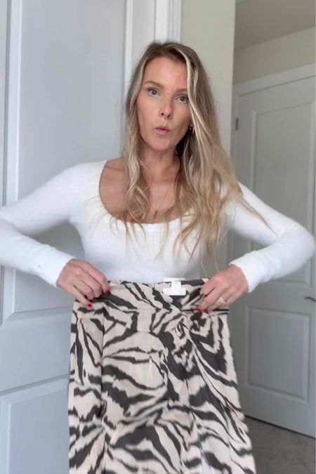 H&M and ASOS haul on TikTok, vacation style, silver beanie, green stroppy heels, midi skirt, ruffle top, tall girl style