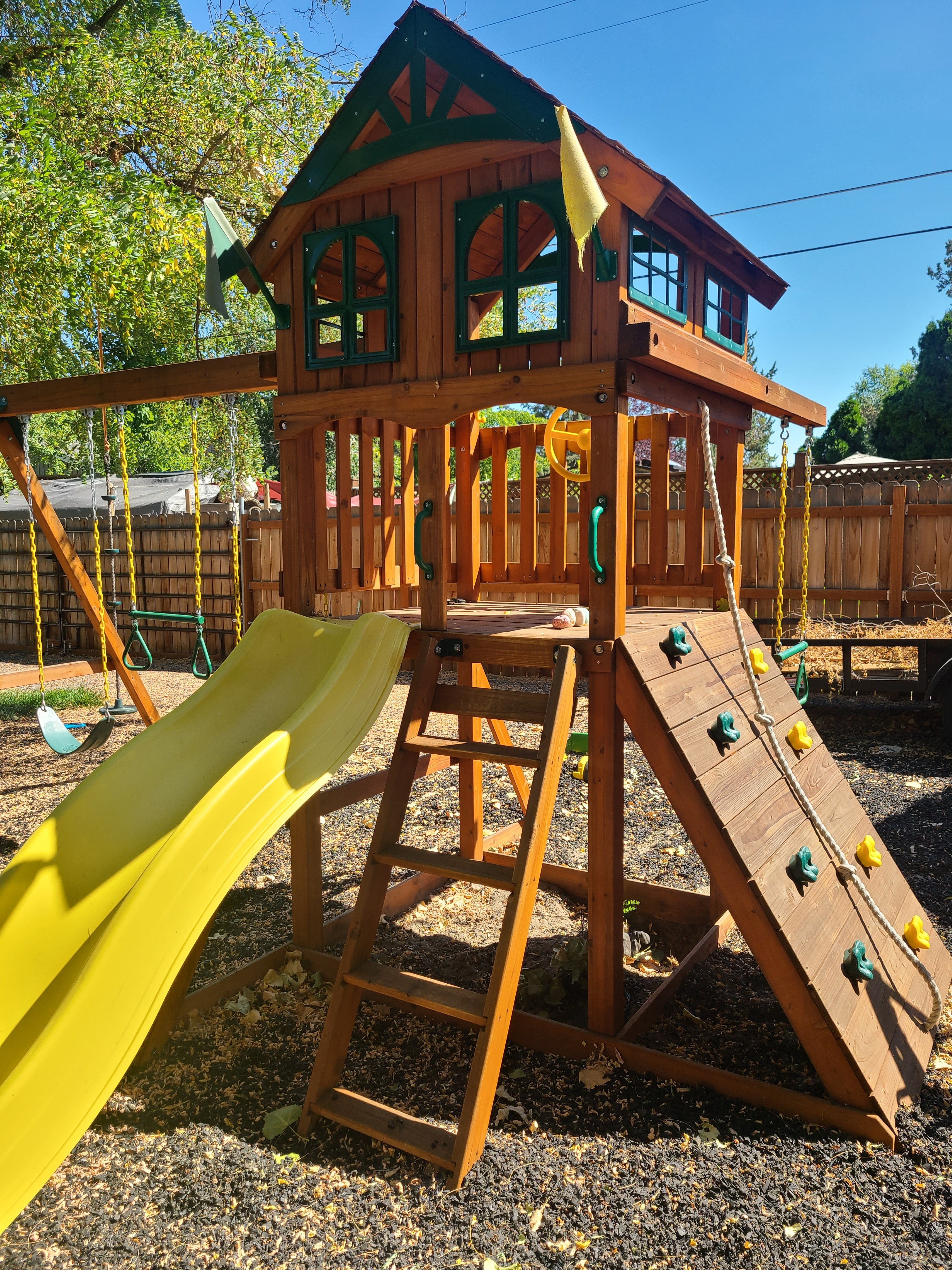 We wanted a backyard that would pull the kids outside without having to beg them. This playset did exactly that. Treehouse, swings, rock wall, slide, sand pit. They disappear out there for hours.  

 