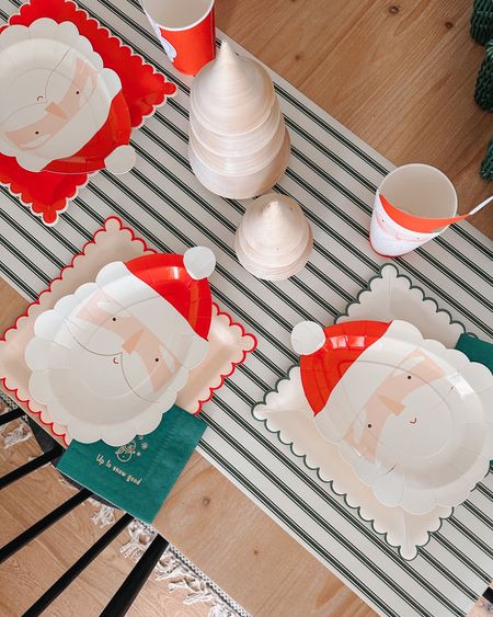 Holiday tablescape. Christmas party table setting for kids. Santa plates and stripe table runner.

#LTKHoliday #LTKfamily #LTKSeasonal