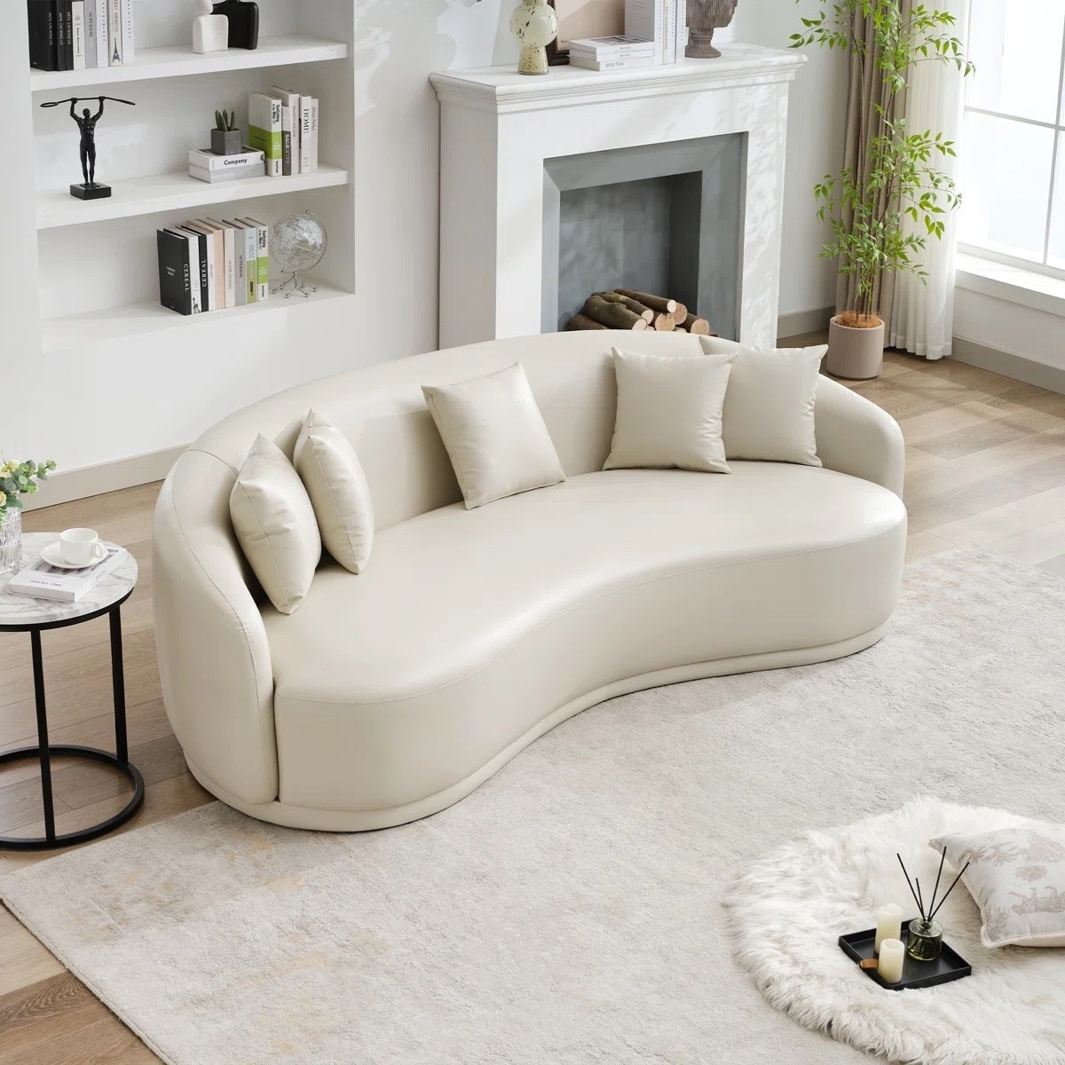 This curved sofa brings an elevated minimalist feel through its clean lines and soft curvature. The faux leather finish adds subtle richness, making it a versatile anchor piece for modern interiors. ON SALE and under $1,200.

Keywords:

* curved sofa
* faux leather sofa
* modern curved couch
* 91 inch sofa
* living room sofa
* statement sofa
* modern living room furniture
* luxury sofa design
* minimalist sofa
* contemporary couch
* neutral living room furniture
* designer inspired sofa
* modern living room sofa
* apartment living room ideas

#LTKSaleAlert #LTKSeasonal #LTKHome