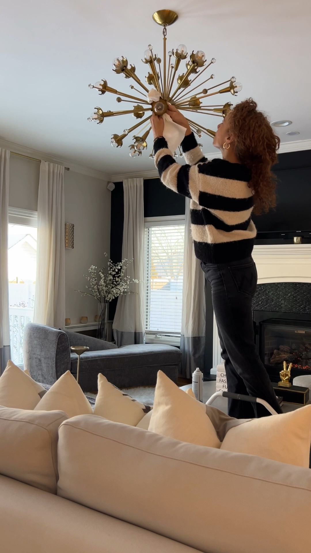 Twenty years ago, this living room had a ceiling fan in the center.

For the makeover, we wanted something more dramatic, so we added this chandelier—and it completely changed the room.

The only regret?
I probably didn’t need all those can lights to begin with.

Sometimes less really is more.

#LTKOver40 #LTKdayinmylife #LTKHome