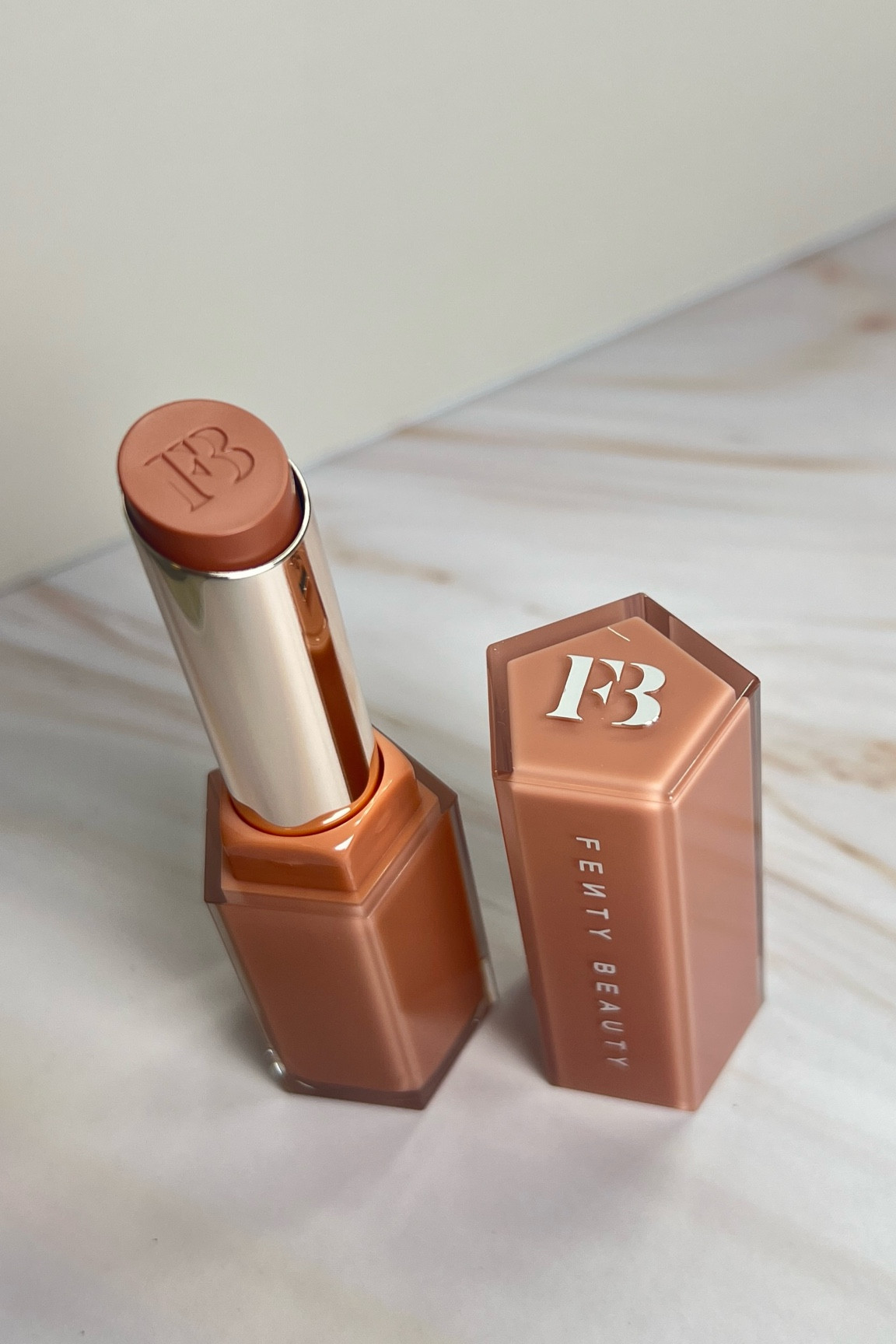 NEW fenty gloss bomb stix high-shine gloss stick - shade fenty glow ($25)

#LTKBeauty #LTKFindsUnder50 #LTKBacktoSchool