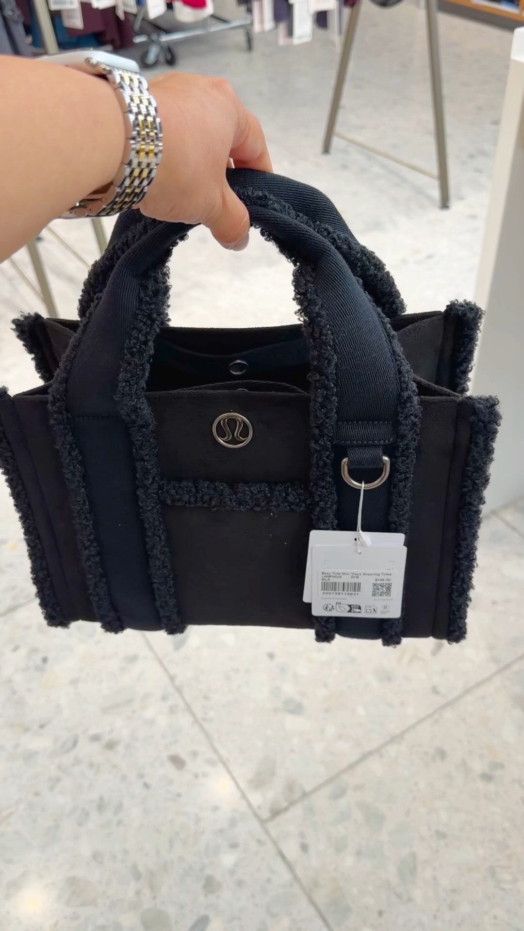 These Lululemon boxy faux shearling trimmed mini tote bags are so cute! This is the smaller 4.5L size. Also comes in a larger 10L size. Lots of other great totes available too and several other styles on sale including this same bag is a lighter neutral color combo. Great for everyday outfits and several bags are really good for workwear and travel too. 

#LTKWorkwear #LTKTravel #LTKGiftGuide