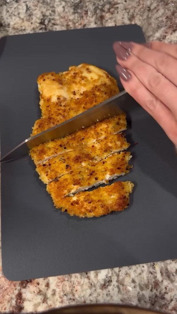 Crusted chicken
Ingredients:
chicken breasts
eggs
Flour of choice (i used almond) 
Bread crumbs & Panko crumbs (you will mix these together) 
Italian seasoning
Salt and pepper 
Olive oil 

Recipe:
Butterfly your chicken breast and season both sides then pound them even (about 1/2 thick) 
Lightly coat both sides of your chicken in flour, then dip in the egg wash, and then in the panko/bread crumb mixture. Your pan should be on medium low heat (anything hotter will burn your chicken crust) 
Once your pan has heated up, add your olive oil and then place your chicken in.  Cook undisturbed for 3 min on each side or until internal temp reaches 165. 
*pounding the chicken so it’s even in thickness is key to get it evenly cooked inside and on the crust without burning the crust* 

#LTKfindsunder50 #LTKfamily #LTKVideo