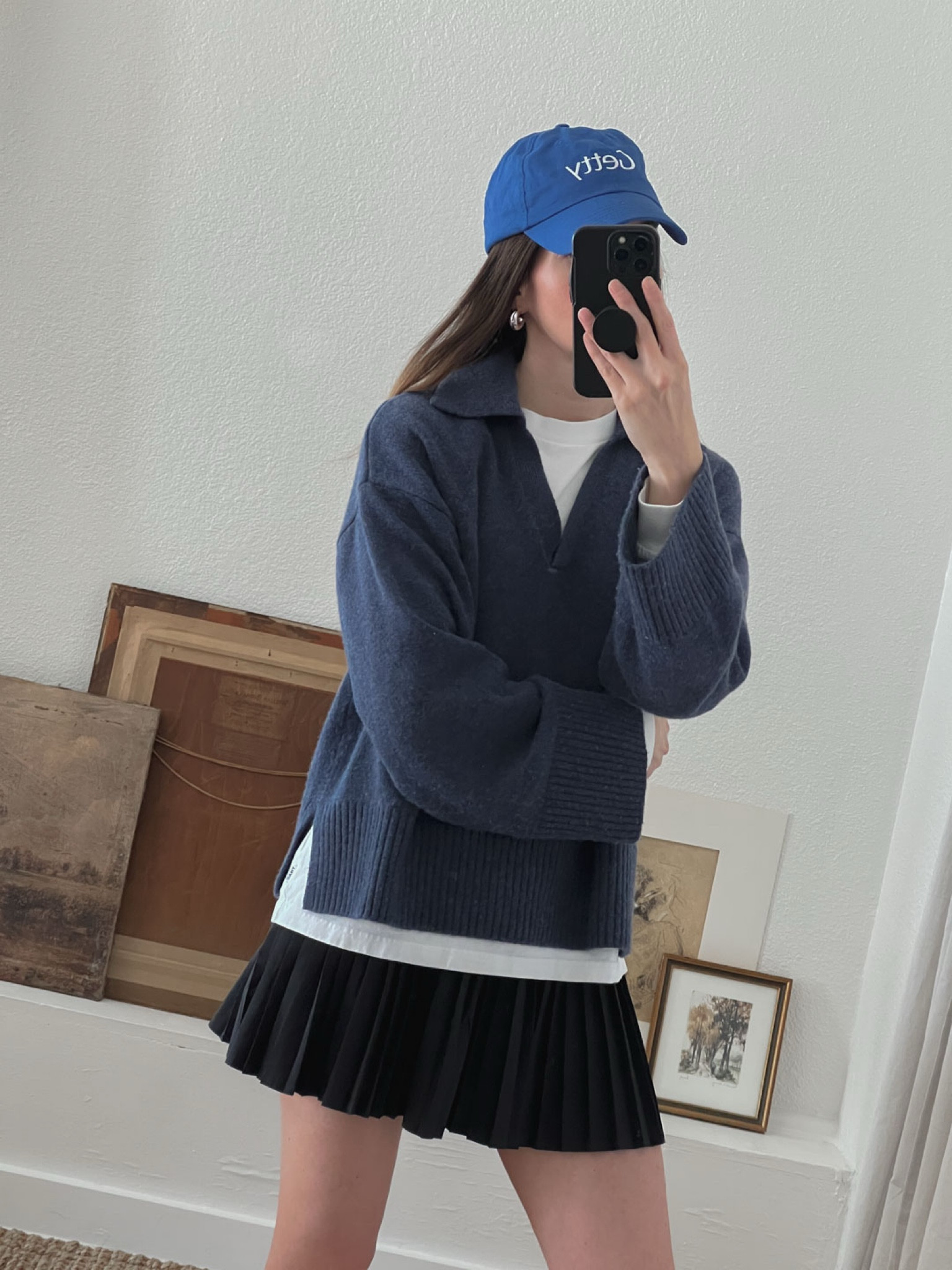 Cozy casual outfit featuring a baseball cap, mini skirt, and polo sweater. 

#LTKTravel #LTKStyleTip #LTKU