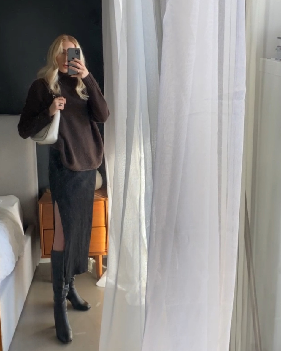 Winter outfit, long skirt, black tall boots, oversized sweater