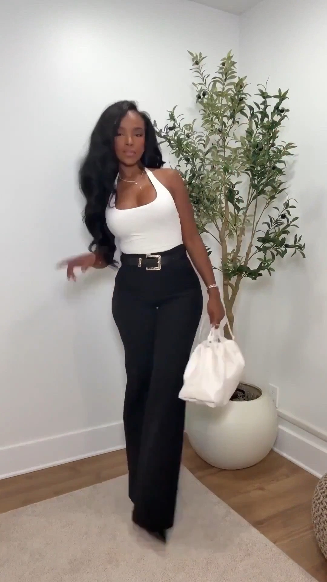 Scroll to shop!! This chic neutral outfit featuring a fitted white halter top styled with high-waisted black flare trousers is perfect for date nights, dinner with friends, or a polished evening outfit that still feels effortless.



#LTKPetite #LTKgrwm #LTKootd