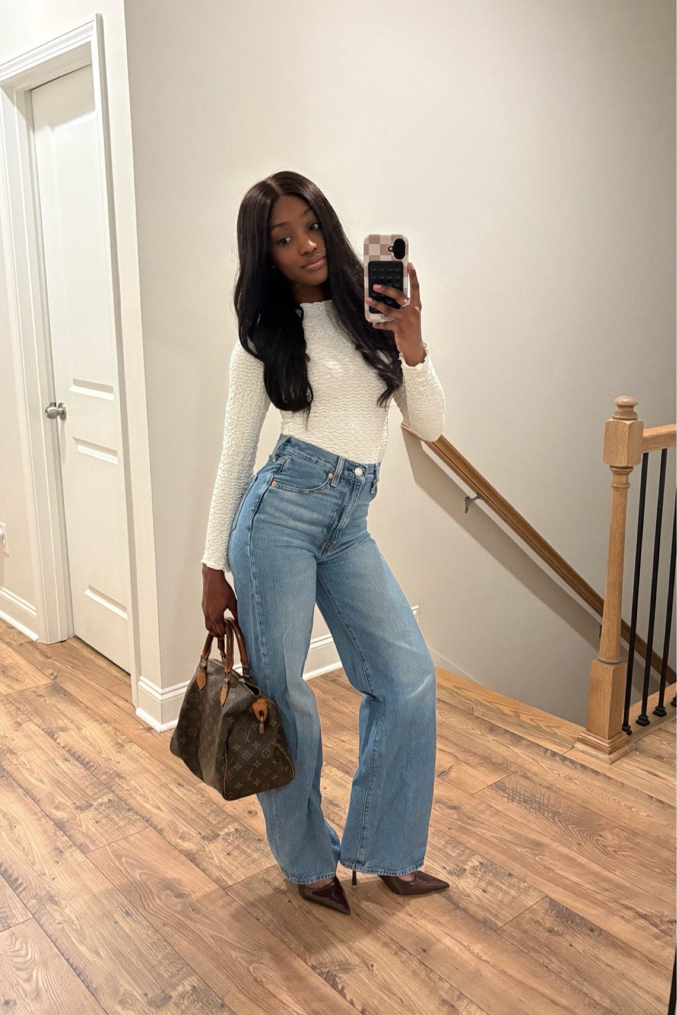 Elevated everyday look featuring a fitted white long sleeve top and high waisted wide leg jeans. 🤍
Styled with brown pointed toe heels and a classic designer handbag for a timeless neutral outfit.

#LTKNYFW #LTKootd #LTKgrwm