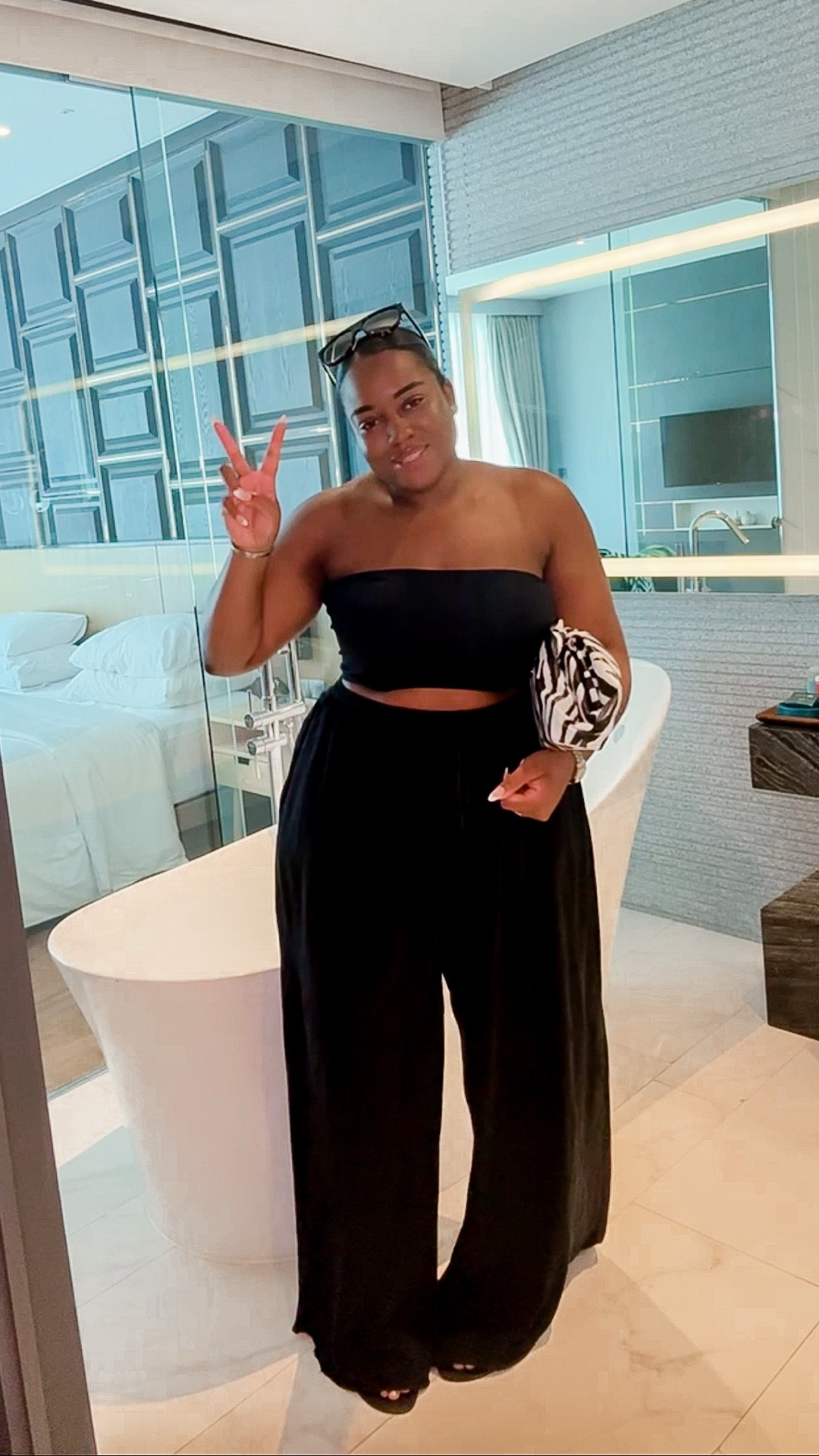 A simple outfit for some holiday Inspo! Featuring a cropped black bandeau, black linen trousers, havaiana flip flops and a statement clutch!

#LTKstyletip #LTKmidsize #LTKuk