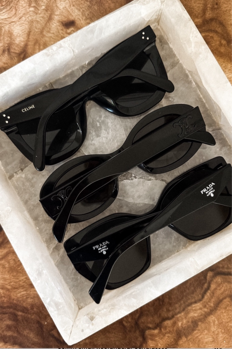 First up are my favorite and most worn pair of sunglasses. The Celine special fit cat eye sunglasses. Ive had these since 2018 and they are my signature pair. Super flattering.

Next are a newer pair, also Celine. The Triomphe oval sunglasses with smoke hardware. I was hesitant to try this shape, but quickly they have become a great modern update and go-to.

Last are the newest pair by Prada. These rectangular oversized sunglasses are a fun play on my signature pair. I love the angular shape and cannot wait to wear into the fall season.
#sunglasses  

#LTKStyleTip #LTKOver40 #LTKOver40 #LTKStyleTip