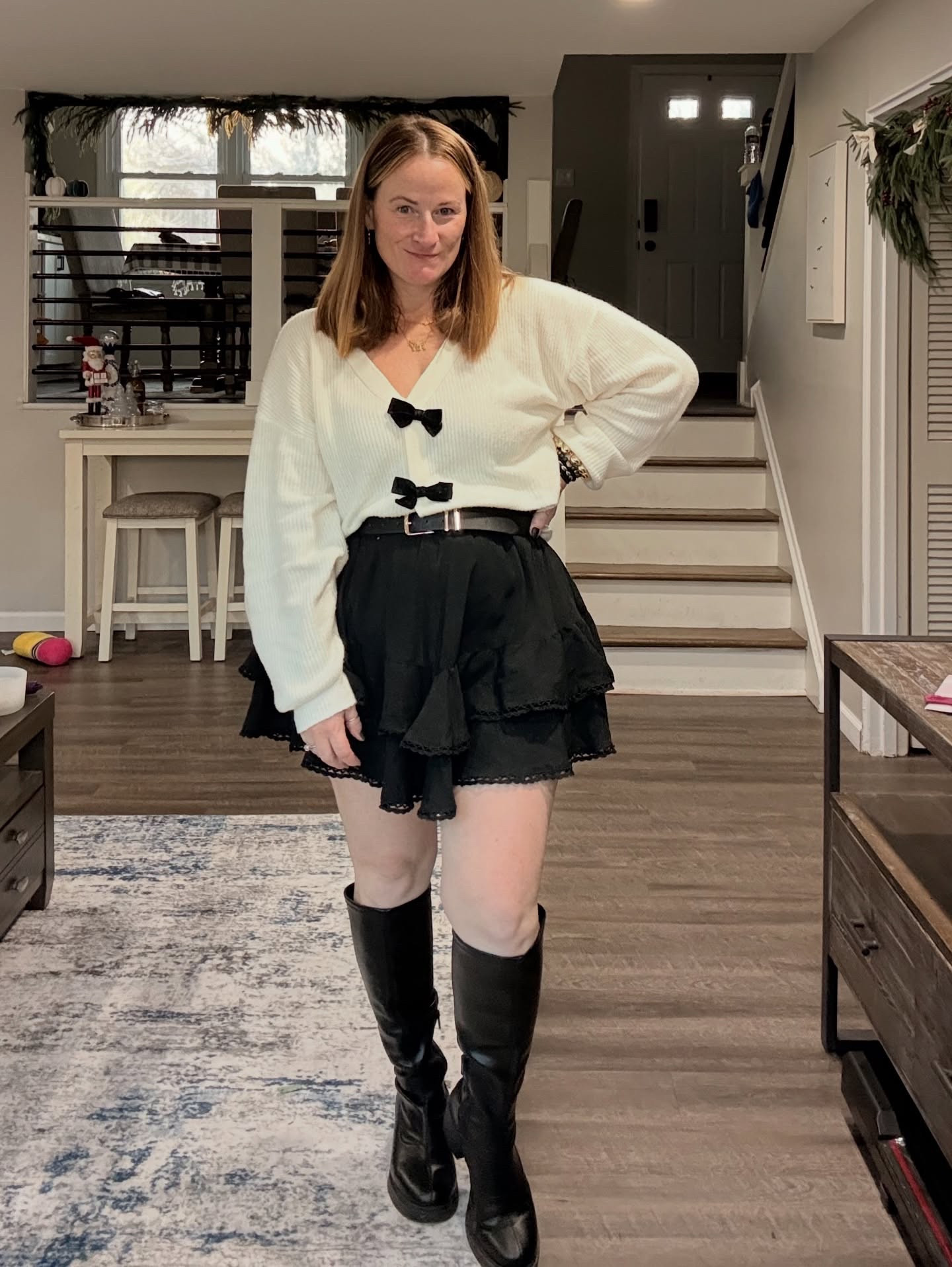 Look of the day. 🤍🖤🎀

I may be in love with this look honestly. Sweater is from @oldnavy Skirt & Belt are from @amazon Boots are from @target

#LTKHoliday #LTKgrwm #LTKootd