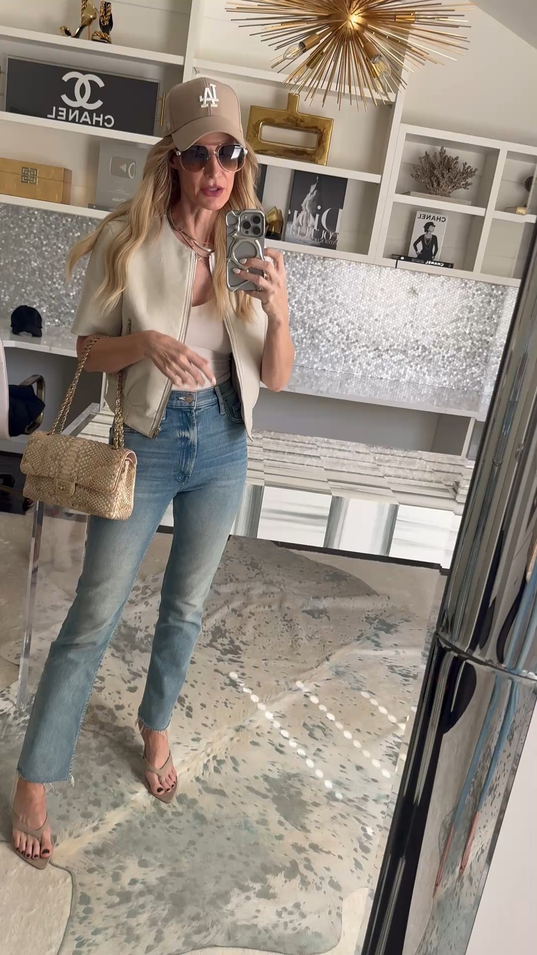 Casual #OOTD but make it chic 👏 This cropped vegan jacket + high-waisted straight leg jeans combo is one of my go-to everyday outfits. Styled with Amazon sunnies (under $20!), kitten heels, and a baseball cap for that effortless off-duty vibe. I’m wearing an XS in the jacket and 24 in the jeans. 

 #LTKSeasonal #LTKOver40