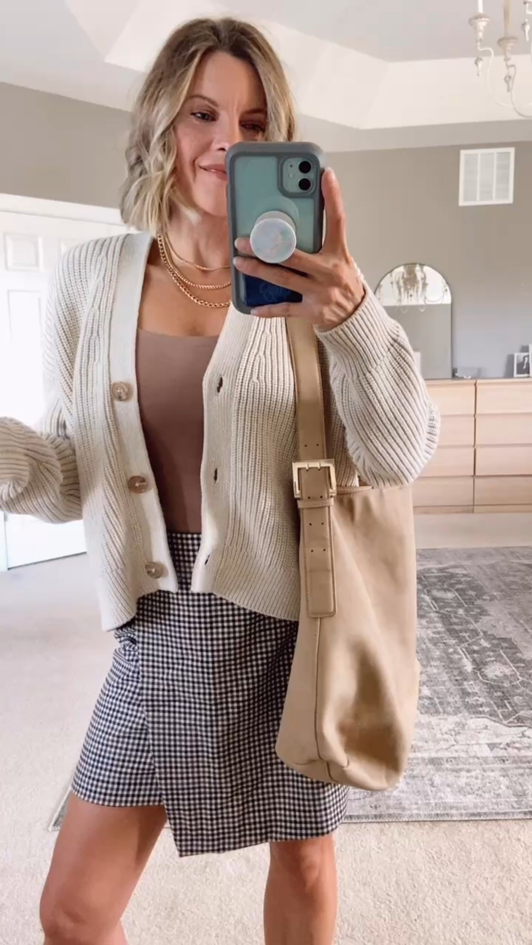 Fall transition outfit
Plaid houndstooth skirt
Cropped button-down boxy fit cardigan 
Faux suede handbagg