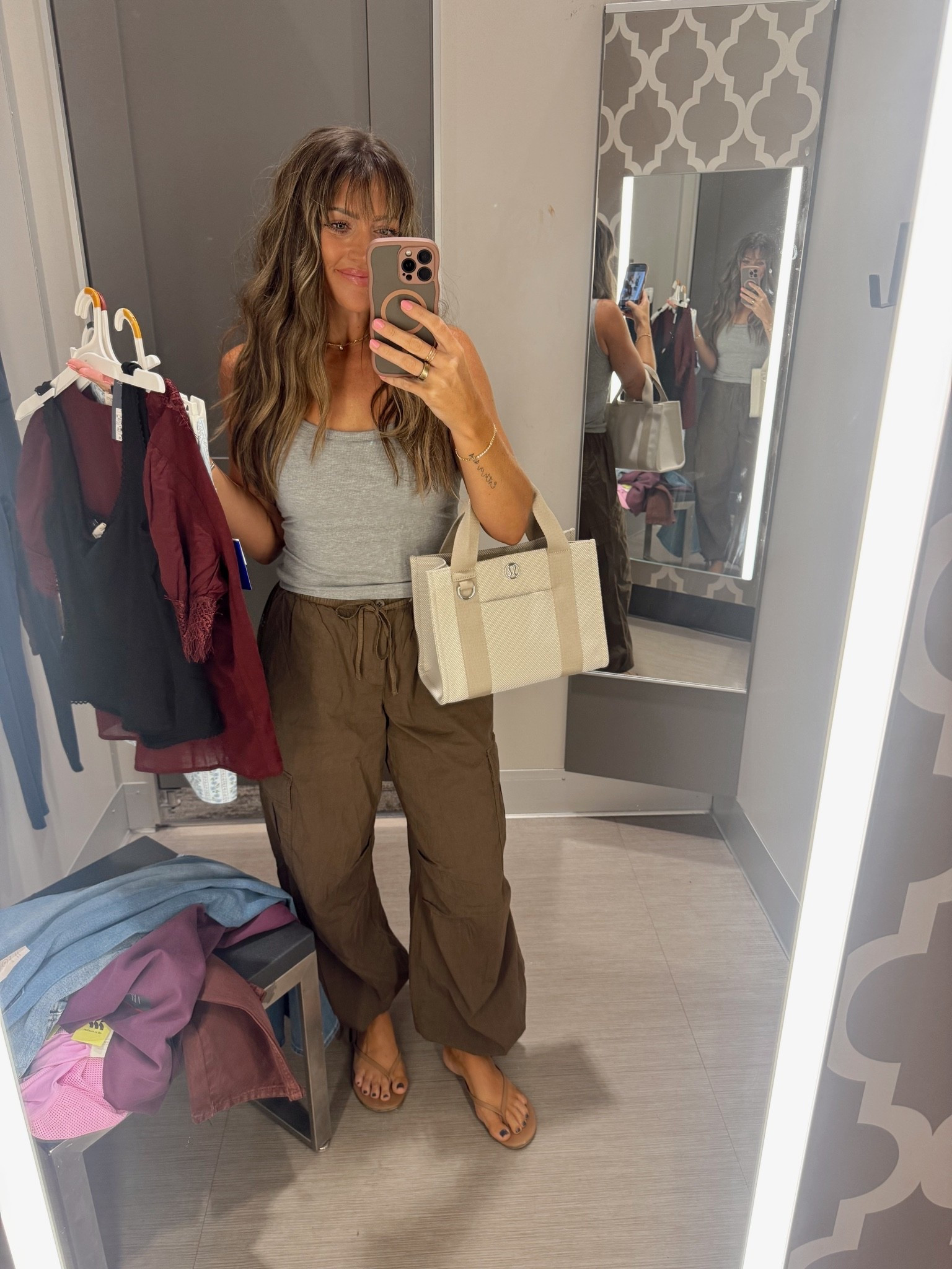 I have these pants in multiple colors — absolutely looove them and I always get compliments!! SO comfy and cute. Wearing XS. Tank has a built-in bra (size small).
