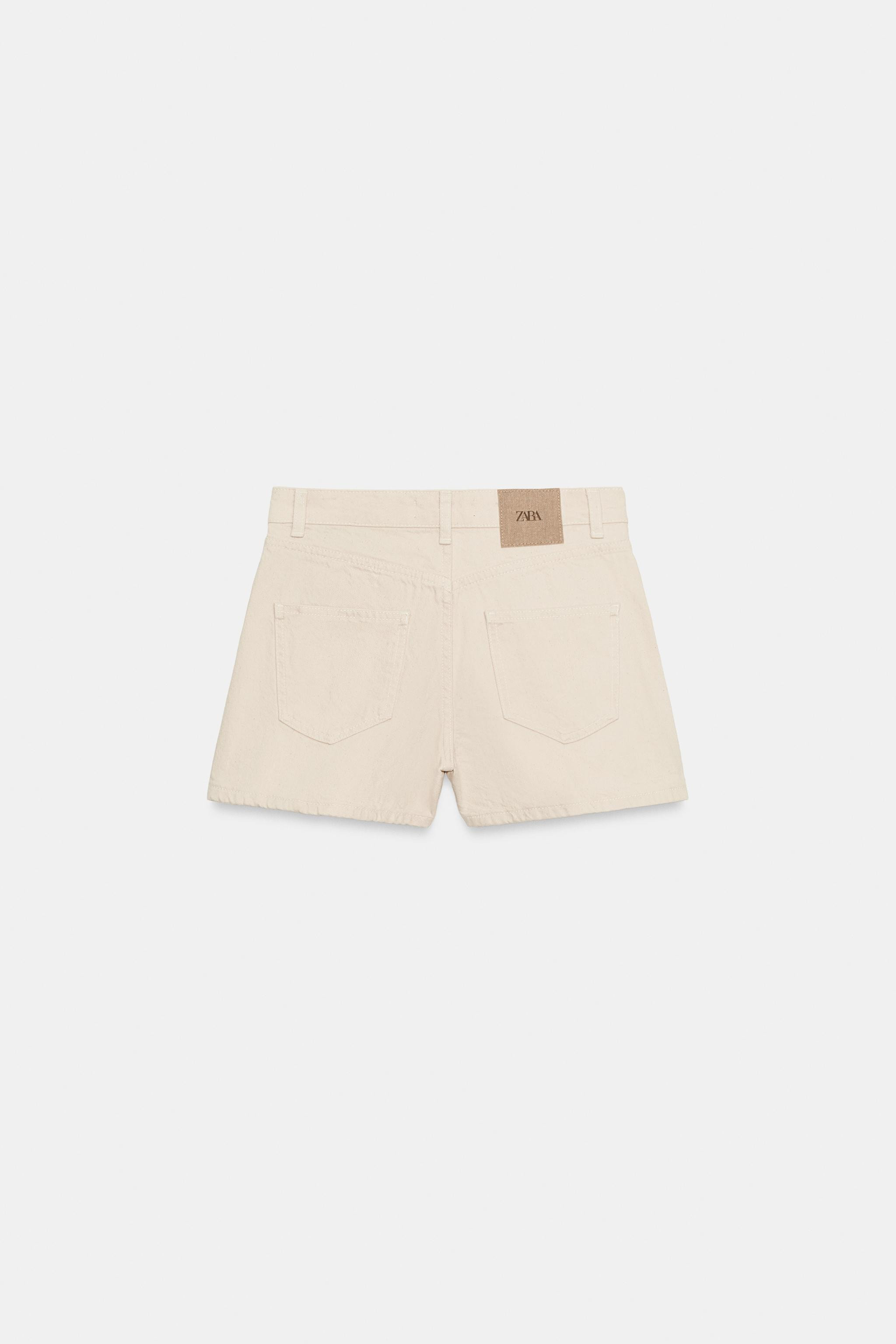 Mid-rise shorts featuring contrast fabric patch pockets and back patch pockets. Front zip and but... | Zara US