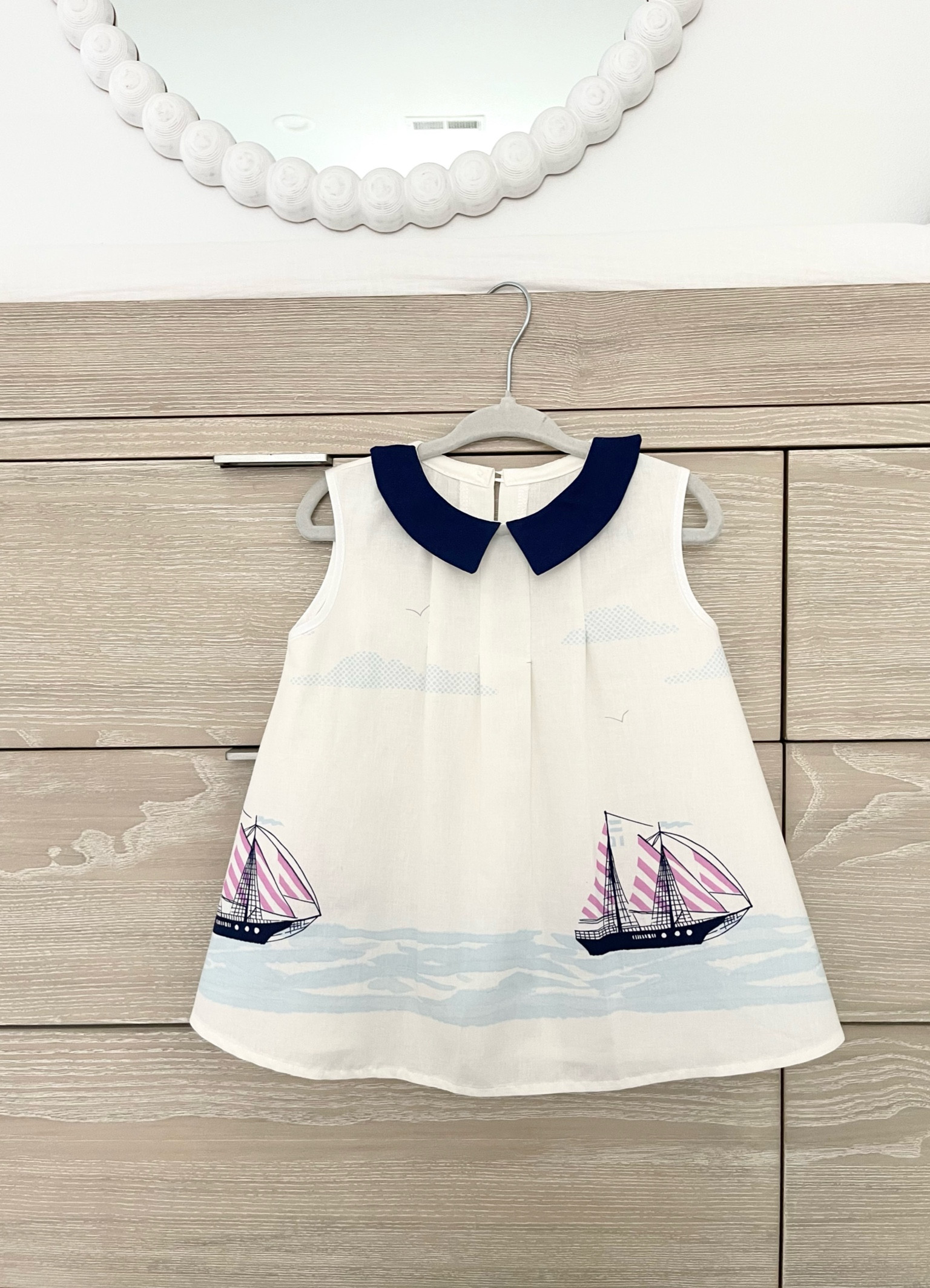 handmade sail dress with collar ⛵️ 
love this darling cotton children’s dress so much I used it as a shirt after my daughter grew out of it 🤍 linked the birthday dress version currently on sale along with my nursery bubble mirror and hangers, dresser and topper are rh landry collection 

#LTKHome #LTKBaby #LTKKids