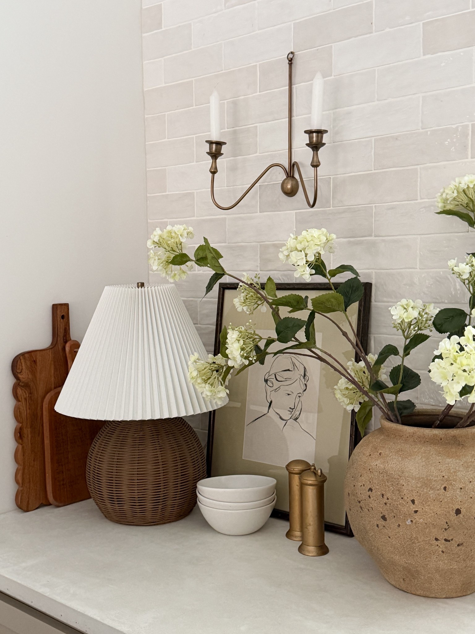 Gave this little corner a refresh for spring! The stems & vase are from hobby lobby and can’t be linked, but here are the details to shop! 
White Hydrangea Stem: SKU 5005012
Beige & Brown Textured Ceramic Vase: SKU 2493922

#LTKSeasonal #LTKFindsUnder50 #LTKHome