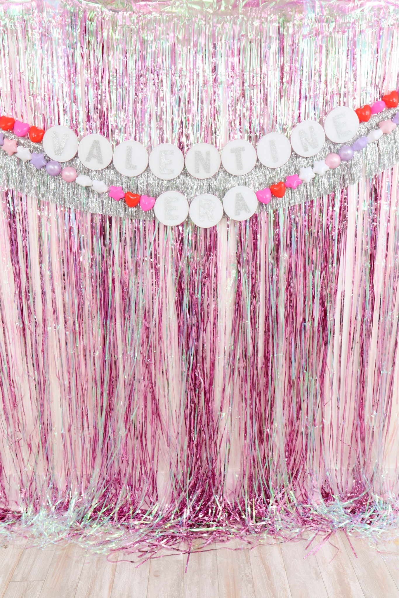 Going into our Valentine Era! Adding in heart “beads” and pink disco tile edges to my oversized Taylor Swift inspired friendship bracelet party garland, doesn’t it look great with a metallic fringe backdrop!

Full tutorial & tips shared on my instagram @fernandmaplestyle
⭐️⭐️⭐️
❤️❤️❤️
#diydollartree #dollartreediy #DIYValentinedecor
#taylorswift #taylorswiftfriendshipbracelets #friendshipbracelet #diyvalentinegarland #diyvalentinedecor #swift #swifties #swiftieforever #taylorswiftinspired #taylorswiftparty #taylorswiftvalentinesday #swiftieforever #jumbofriendshipbracelet

#LTKkids #LTKparties #LTKSeasonal