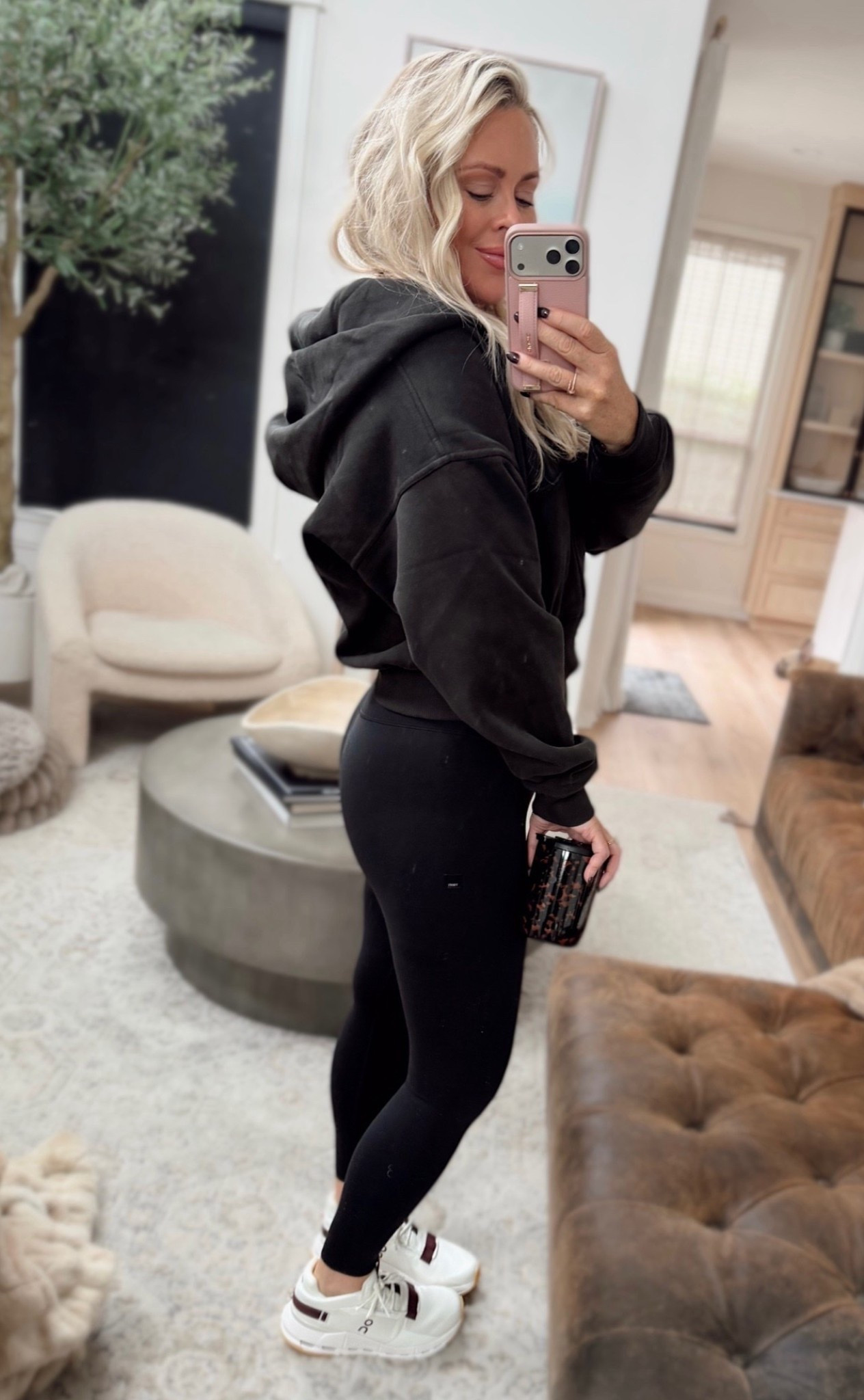 This washed black Vuori full zip might be my favorite layer for fall 🖤 I love how the softer black looks with leggings and sneakers for an easy everyday outfit. Everything I’m wearing is a small