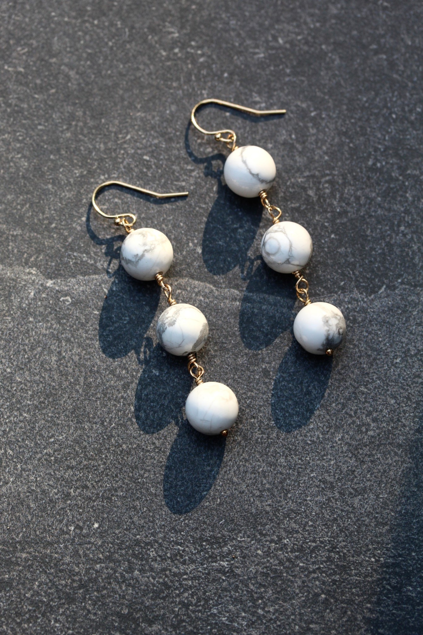 Triple howlite and gold dangle earrings🤍

#LTKWorkwear #LTKValentine #LTKBeauty