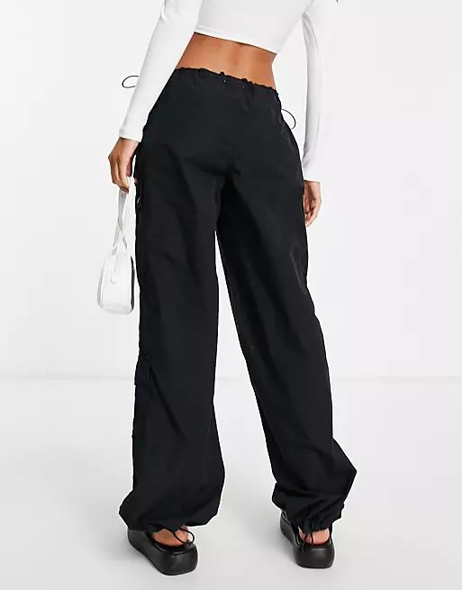 Topshop oversized mid rise balloon cargo pants with utility pockets in washed black | ASOS | ASOS (Global)