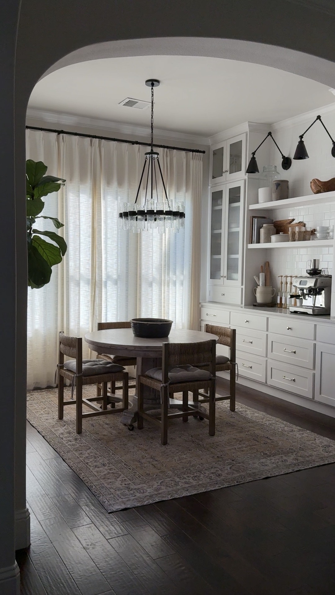 ☀️ The best linen drapes ☀️ 

🚨 Drapes are 24% off with code CRAZYWONDERFUL now through Sept. 10th

In out kitchen dining room I have them in the LIZ fabric, Ivory White color, pinch pleat header.

My rug is a vintage one-of-a-kind but I’m linking to others that are similar in style.

Woven dining chairs, round dining table, black library sconces, glass chandelier, espresso machine

#LTKHome #LTKSaleAlert