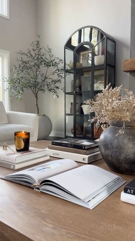 I love an oversized coffee table, and I love decorating with dimension, layered, and tons of books! When restyling our coffee table I knew I wanted to add more books. I grabbed a ton of these neutral and earthy toned ones from Amazon and I love how simple yet beautiful it is! 

#LTKhome #LTKstyletip