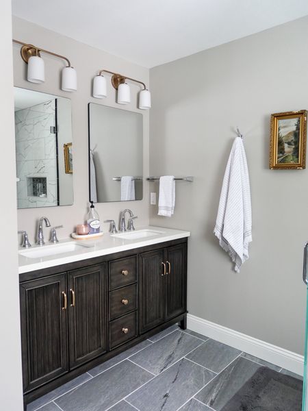 Bathroom is complete! I love how the hardware swap on the bathroom vanity makes it more my own. And these hooks and towel bars are perfection  

#LTKfindsunder100 #LTKfindsunder50 #LTKhome