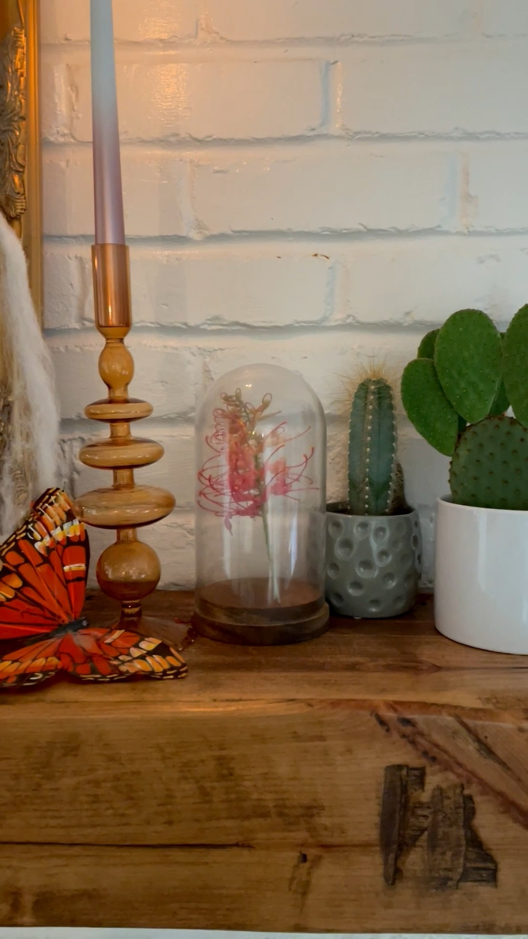 This is my Day of the Dead inspired mantle.  💀 My top tip for holiday decor is this- don’t let it look like a Spirit Halloween set up shop in your house.  
💀Use natural elements and decor you already have to add seasonal touches.  
💀Work within your existing style and color palette.  
💀Have fun with it but don’t fill your entire garage with holiday decorations or spend too much! 

#LTKHome #LTKHalloween #LTKSeasonal