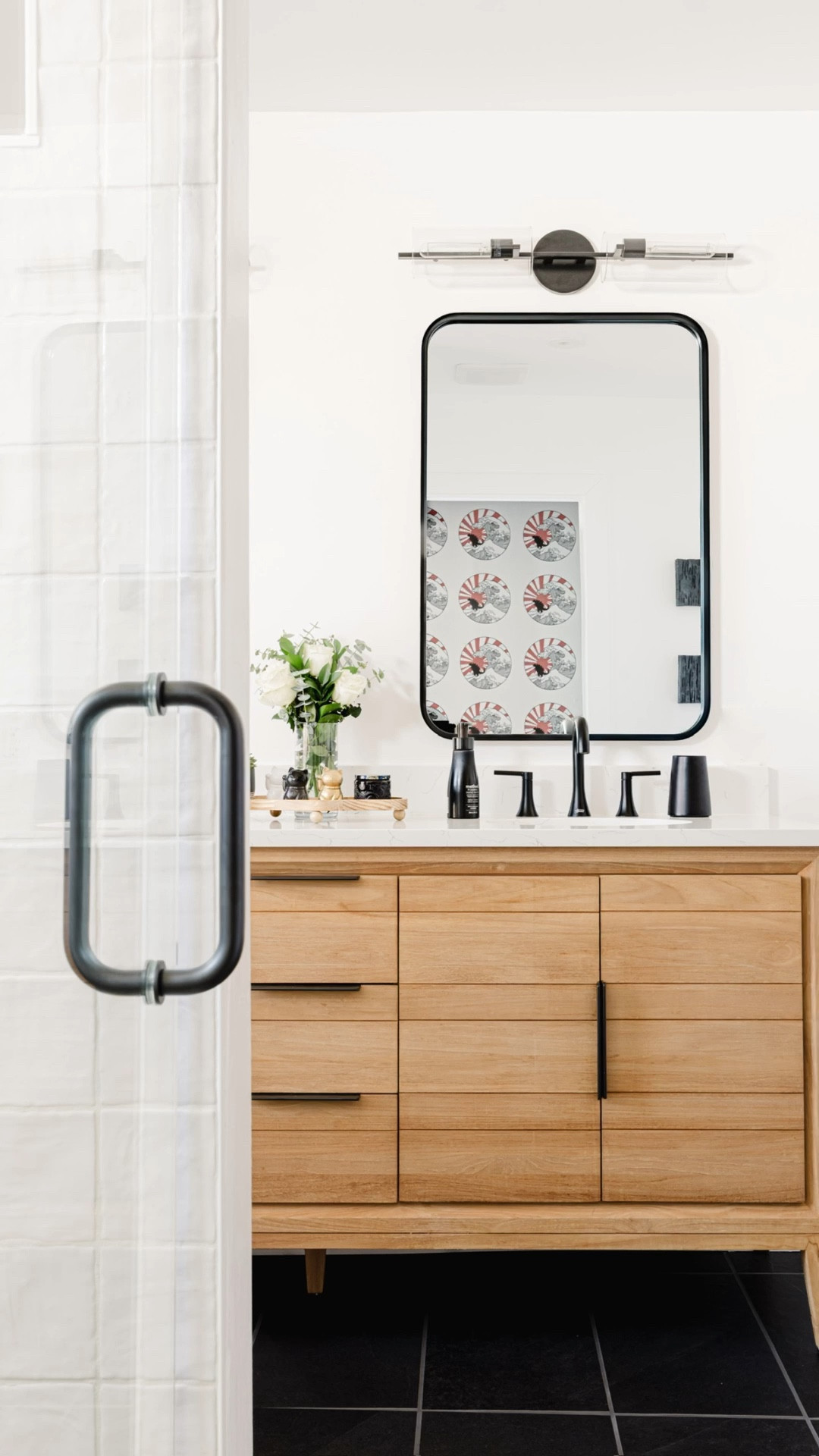 This bathroom vanity is so stunning. It has so much storage, mid-century flair, sleek black hardware, and white under mount sinks. Shown is the teak with a white quartz countertop.

#LTKHome