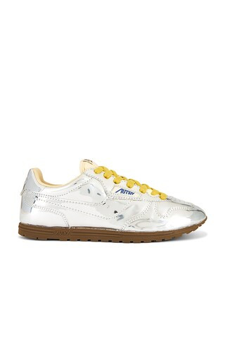 Autry Windspin Low Sneaker in Silver & Ivory from Revolve.com | Revolve Clothing (Global)