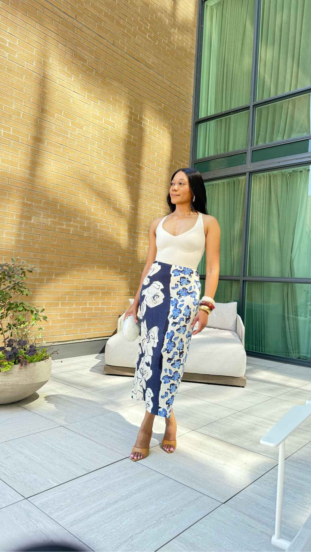 This is one of my favourite looks! It’s comfortable, stylish and feminine. You absolutely need this bodysuit - it snatches you all the way in. I’m wearing a size small for reference. The skirt is Zara but is sold out, so I’ve linked some other pencil skirts that’ll go well with this look. 

Summer outfit, fall transitional outfit, pencil skirt, what to wear, how to style, date night outfit, vacation outfit, resort wear, heeled mules, sandals, bangles, bracelets, pearl clutch, bodysuit, shapewear, skims 

#LTKParties 

#LTKSeasonal #LTKTravel