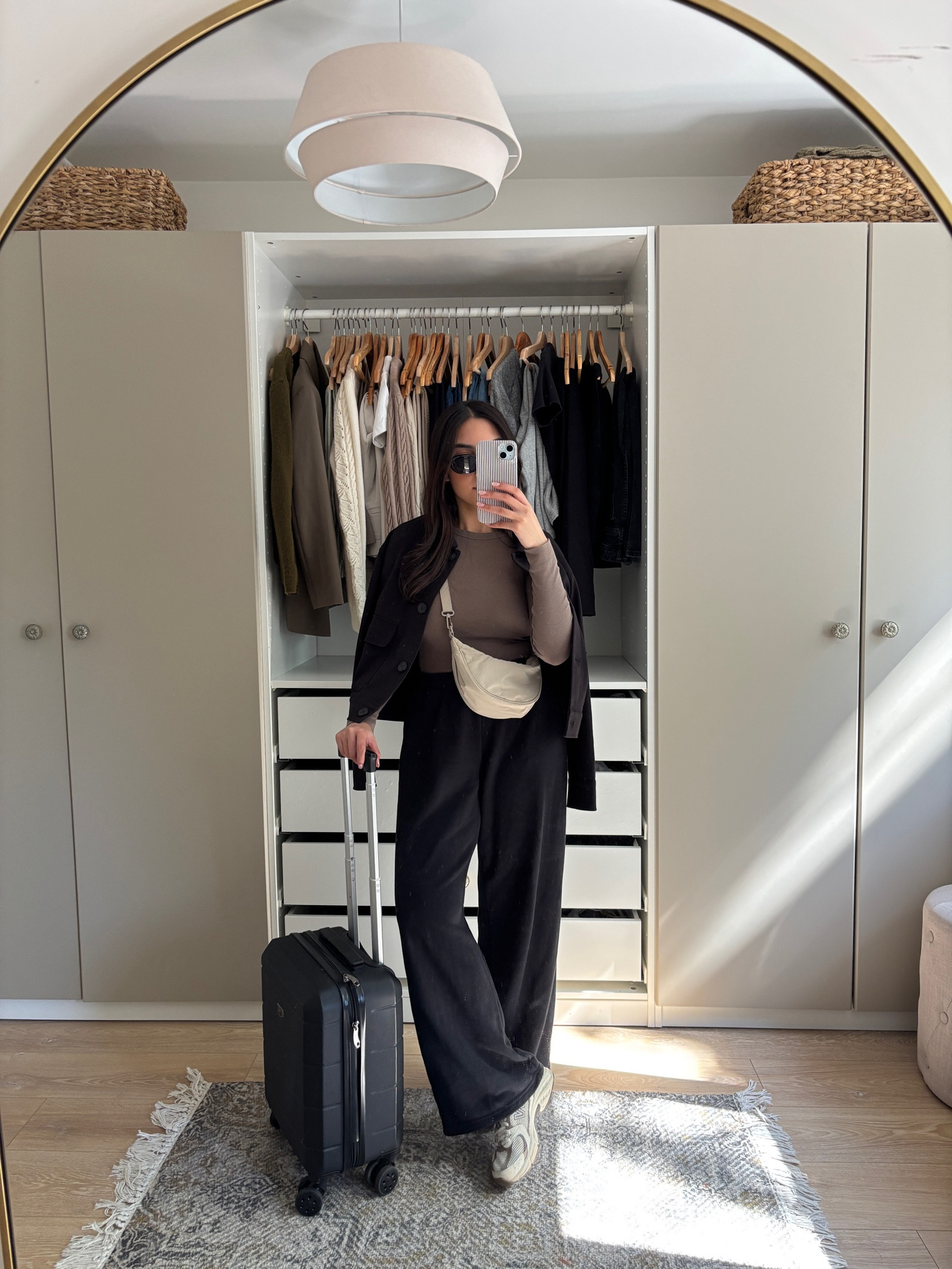 black joggers, uniqlo, petite friendly, wide leg joggers, travel outfit, airport outfit, short jacket, black jacket, light jacket, spring jacket, Uniqlo viral bag, moon bag, suitcase, Ryanair cabin bag, new balance, new balance 530, new balance beige trainers, trainers, bring casual outfit, summer casual outfit, comfortable outfit, travel outfit

#LTKeurope #LTKSeasonal #LTKfindsunder50