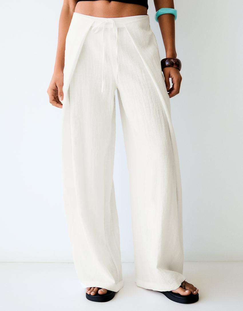 Wide-leg rustic pleated trousers - Women | Bershka UK