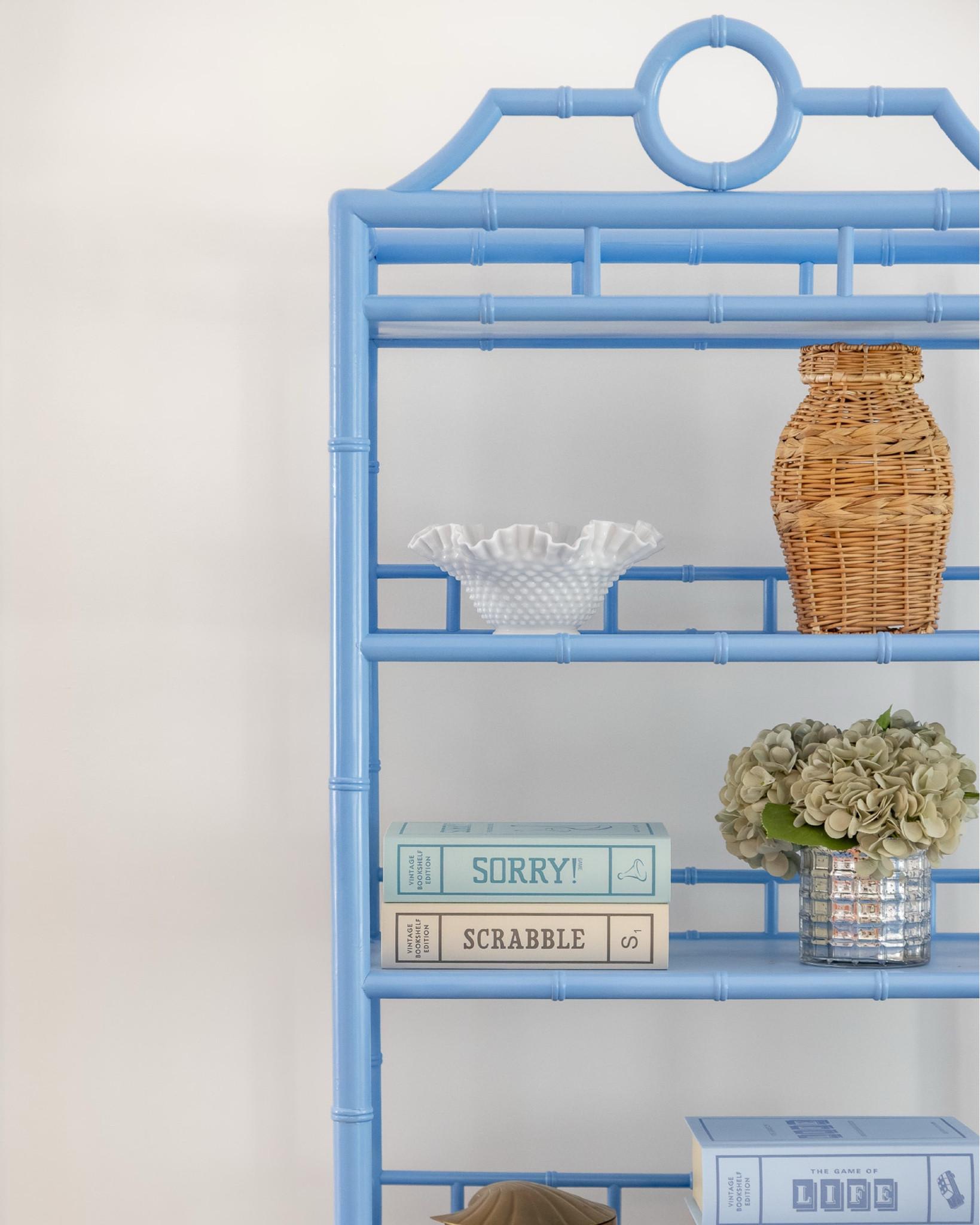 getting up close and personal with the living room at the #preppyhollowhouse! let's take a closer look at some of the details in the space, from the bold blue étagère stacked with vintage book-inspired board games to the faux bamboo console featuring a milk glass lamp with a handmade striped shade...and let's not forget the portrait of JFK on the beach! #dwelloctoberstay #dwelloctober

#LTKHome