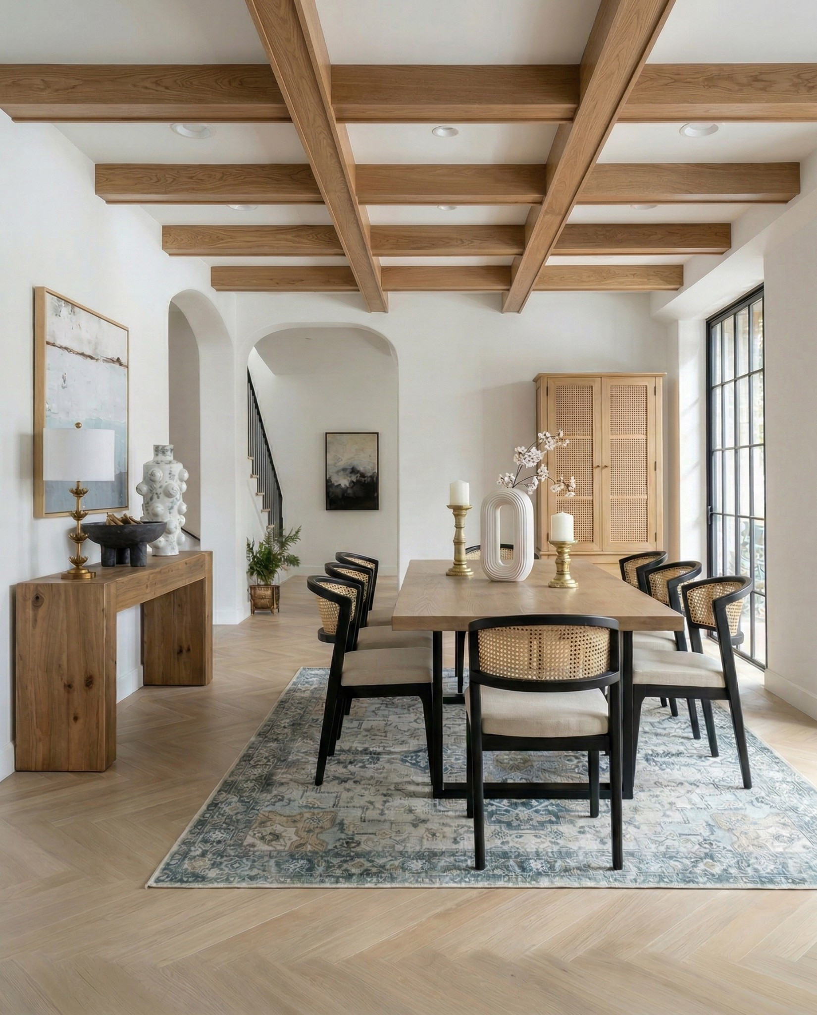 Wood Dining Table
Black upholstered dining  Chairs 
Wood console table
Brass table lamp 
White ceramic vase
Brass candle holders
Blue wall art
Neutral modern wall art
Brass wall sconce 
Wood cabinets 
Blue traditional pattern rug
Blue wall paper
Tall ceramic vase
Black decor bowl 

#LTKSaleAlert #LTKHome