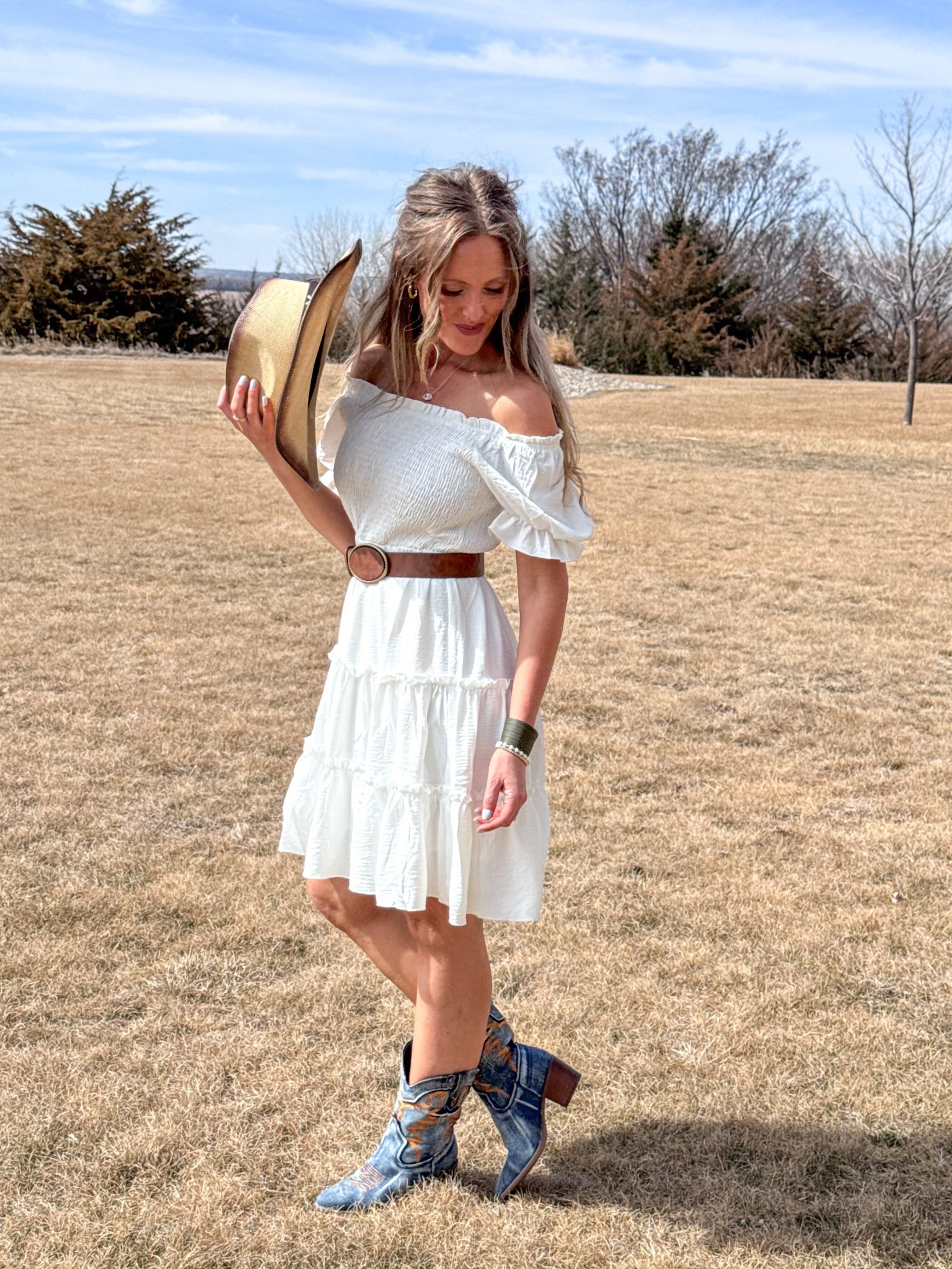 This whole look! 🤍 So good for festival or a country concert! 🎵🤠  This white off the shoulder dress is perfect and these denim boots are gorgeous! Topped off with this brown belt and cowgirl hat for such a cute country look! Wearing a small in the dress.

As an Amazon Influencer I earn commission on qualifying purchases.

Country concert outfit inspo, festival look, white dress, mom style, spring fashion 2026 

#LTKMidsize #LTKootd #LTKFestival
