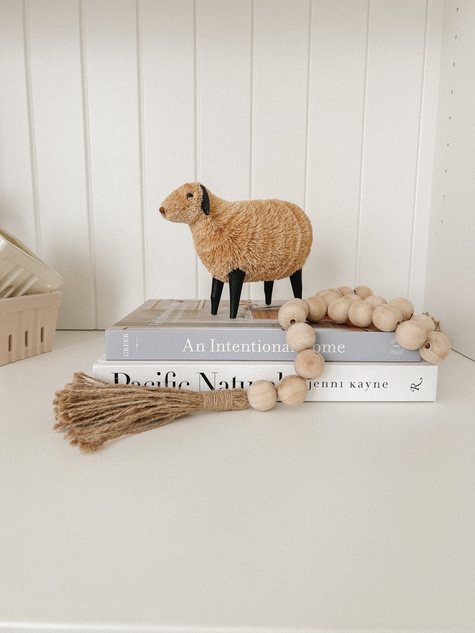 Another easy Spring Decor Scene for your shelves or coffee table! Grab a few coffee table books, a lamb figurine and a wood bead garland. Voila, a fresh Spring Scene for your family and your home! 
Spring Decor
Spring Decoration
Easter Decor
Easter Decoration 
Sheep Decor
Sheep Figurine
Lamb Decor
Lamb Figurine

#LTKFindsUnder50 #LTKSeasonal #LTKHome