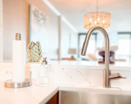 Who doesn’t love a clean and uncluttered kitchen counter? We are loving our kitchen refresh! The white has brightened everything up! 

Refillable foaming soap dispenser 
Paper towels holder
Green & gold leaf vase
Rattan dining chandelier 

#LTKsalealert #LTKfindsunder100 #LTKhome