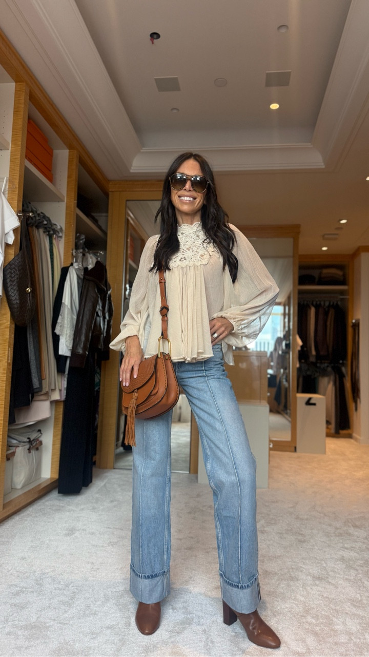 Style 1: 
Boho Cic Paired the jeans with 
a flowy blouse, 
cognac-colored boots, and a leather purse — perfect for fall brunch with the girls 🍂