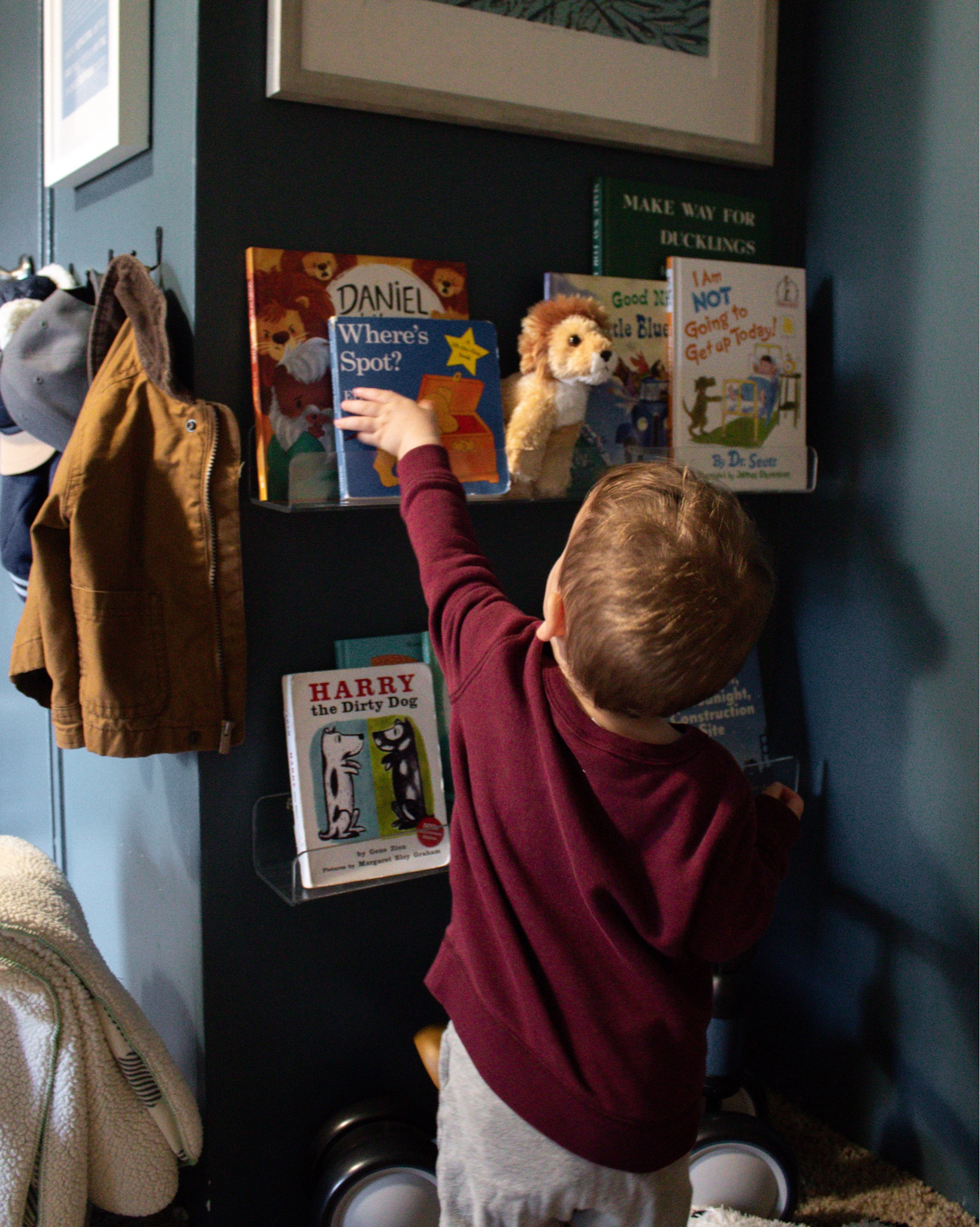 It’s always hard to get a picture of this little corner because of the bad lighting, but we love our little bookshelves! I made sure they were low enough so Shepherd could grab books whenever he wants. And the clear acrylic shelves blend so well with his room. 

Linked some of his favorite books, too 

Toddler boy room. Navy blue kids room. Playroom ideas. Navy blue nursery. Dark and moody baby nursery. Traditional baby nursery ideas

#LTKkids #LTKhome #LTKfamily